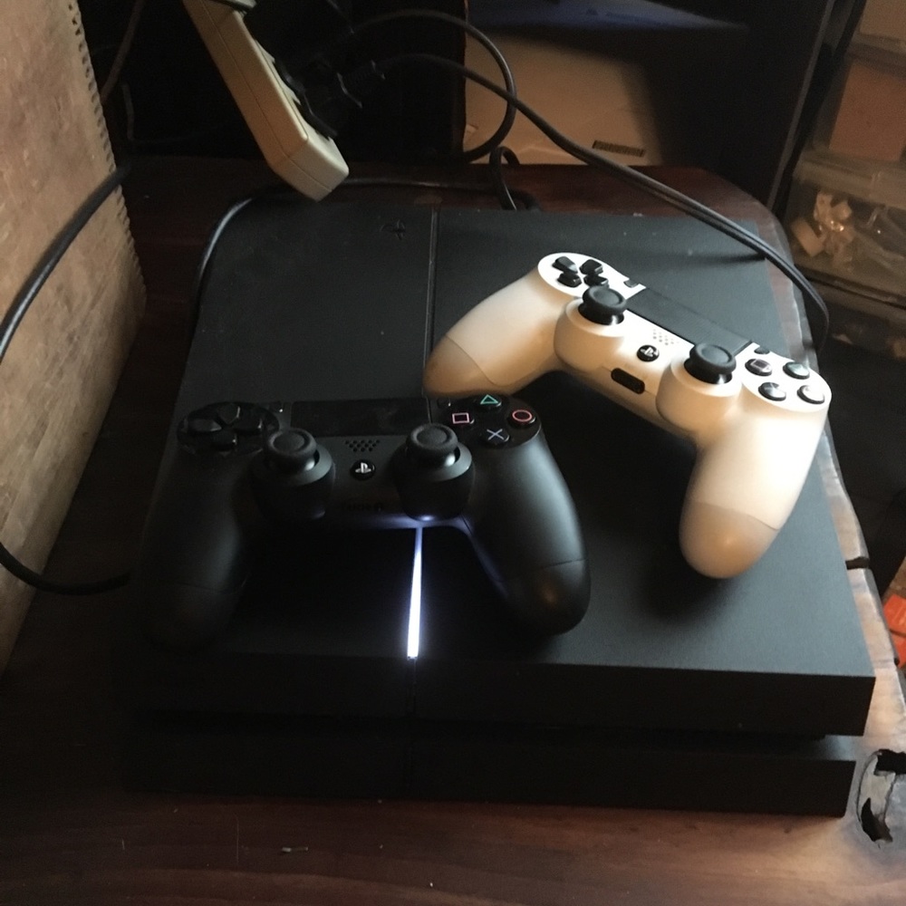 PS4 with 2 controllers and games!